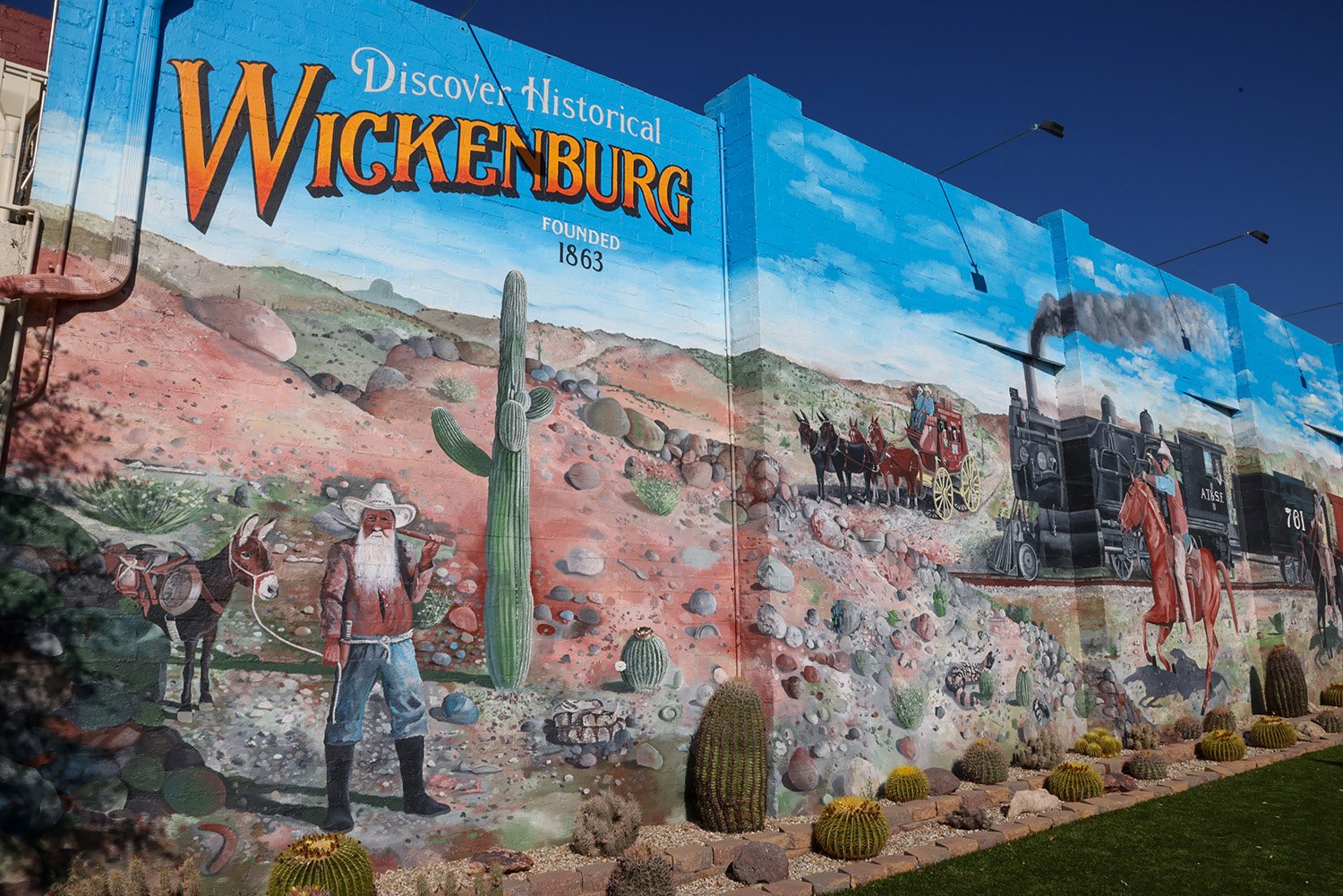 A painted mural reading Discover Historical Wickenburg, founded 1863.